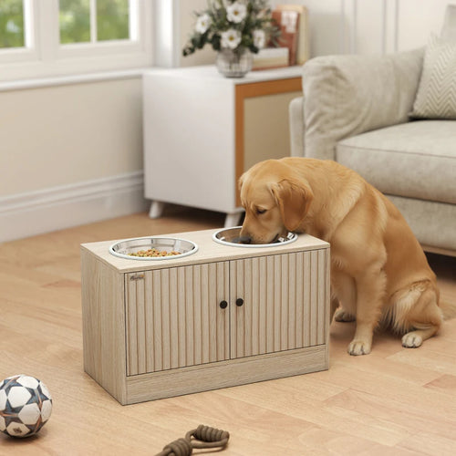 Golden retriever eating from a light wood raised dog bowl stand
