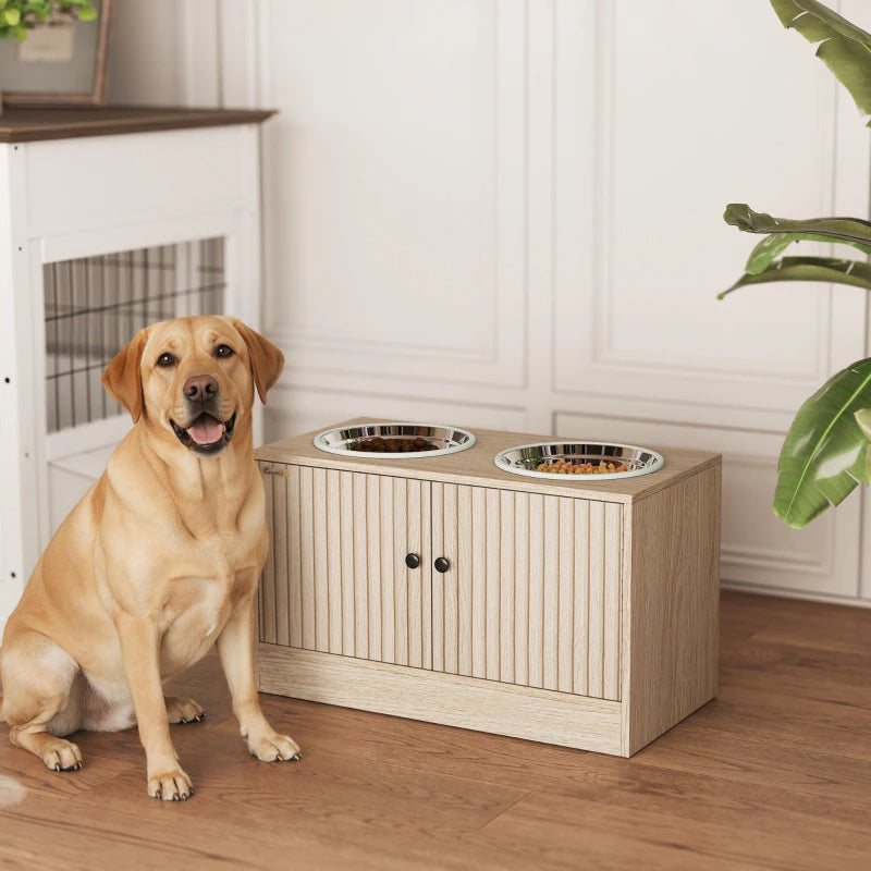Labrador sitting beside a light wood elevated dog feeder